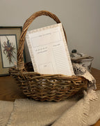 Wicker basket with everyday tear-off product inside on a wooden surface