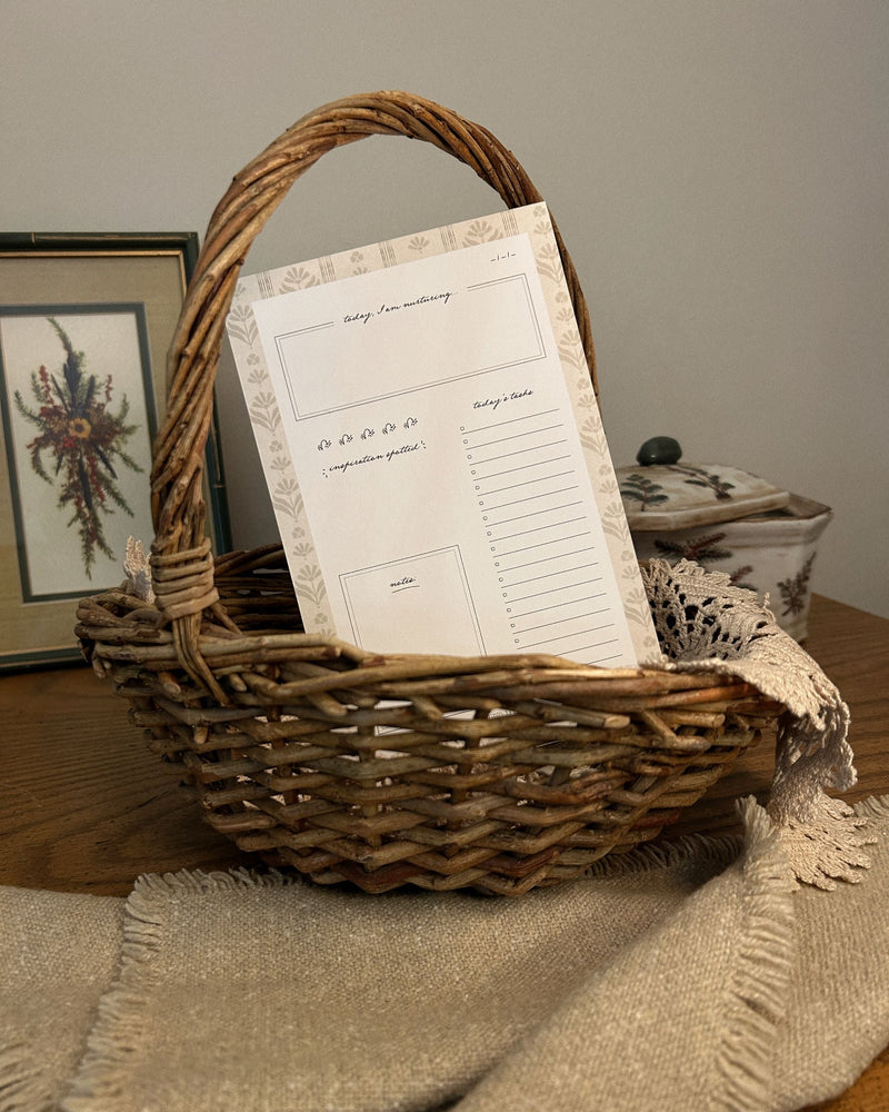 Wicker basket with everyday tear-off product inside on a wooden surface